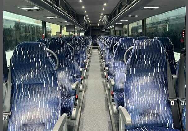 A bus with many seats in it
